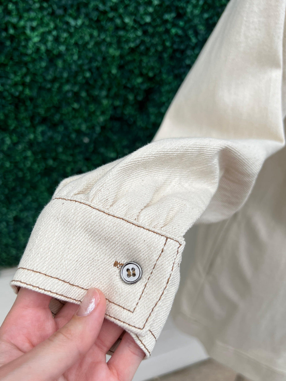 Cream Denim Dress featuring a long sleeve V neck and buttons at the sleeves by entro brand
