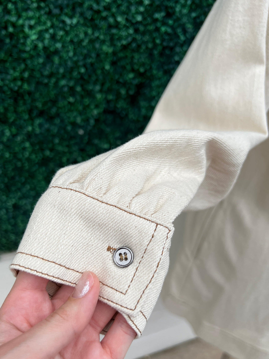 Cream Denim Dress featuring a long sleeve V neck and buttons at the sleeves by entro brand