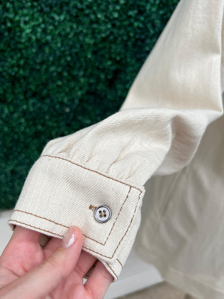 Cream Denim Dress featuring a long sleeve V neck and buttons at the sleeves by entro brand