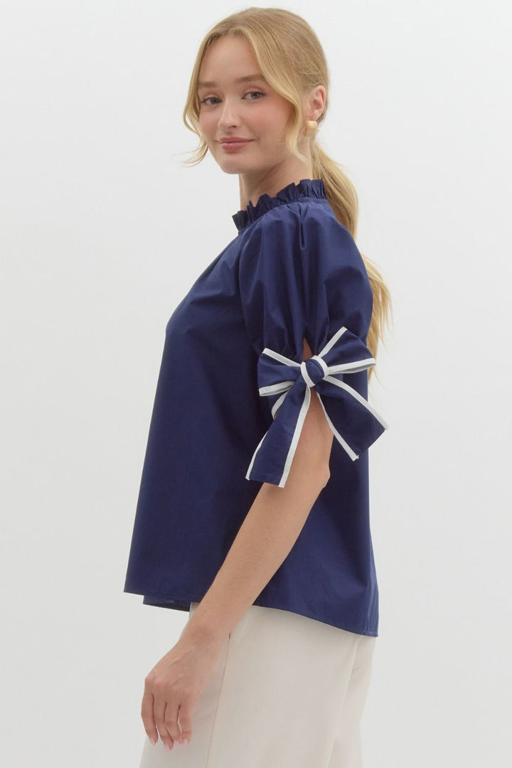 side of Navy Bow Puff Sleeve Blouse ruffle neck cotton entro brand