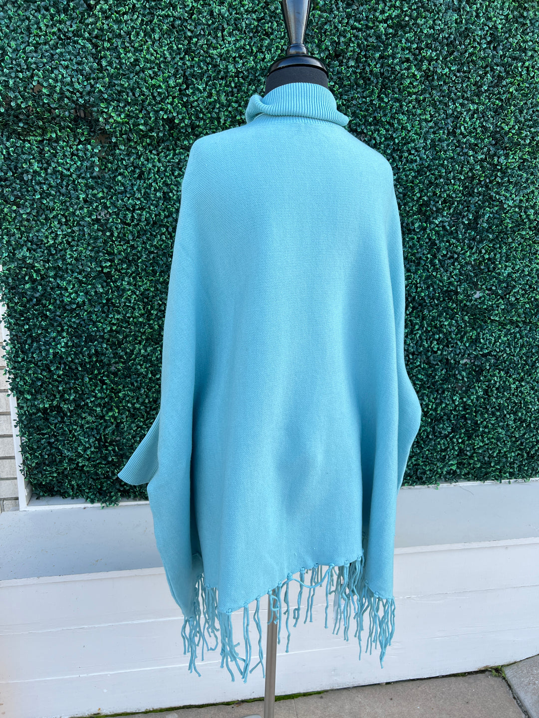 Turtleneck Acrylic Fringe Poncho Sweater baby blue and red with sleeves back