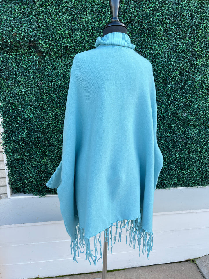 Turtleneck Acrylic Fringe Poncho Sweater baby blue and red with sleeves back