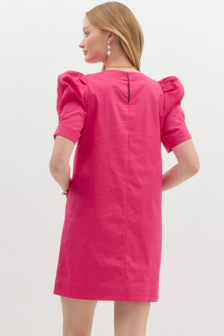 back of Jackie O Cotton Sheath Dress hot pink with puff sleeves and pockets with gold button 