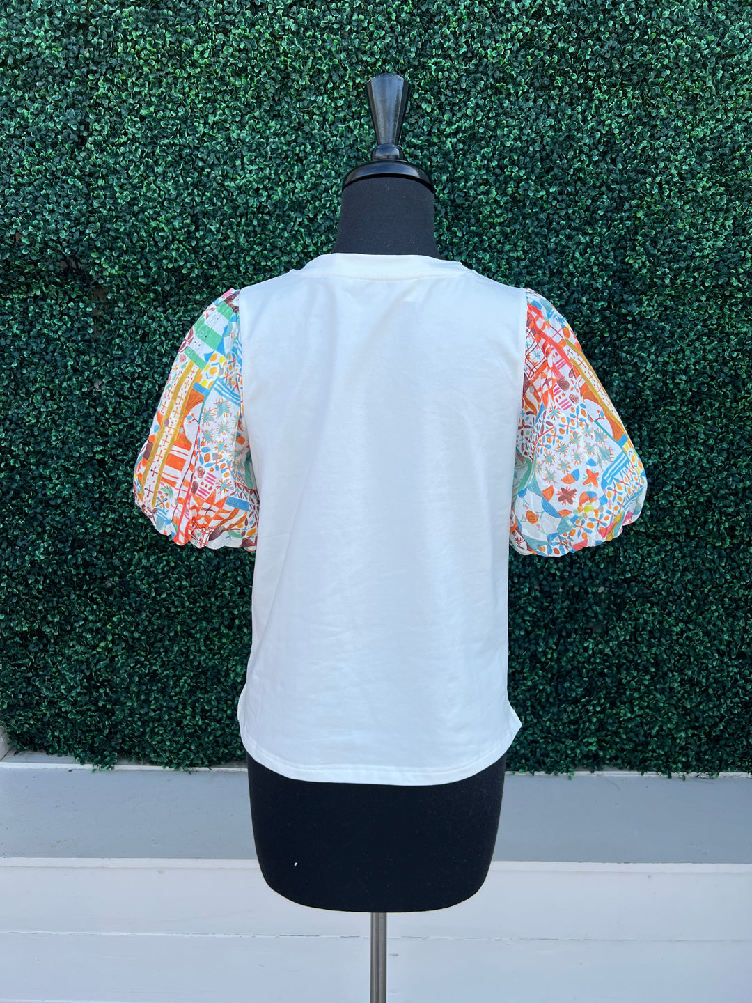 back of printed eyelet patchwork contrasting sleeves on white tee joy joy tres chic boutique