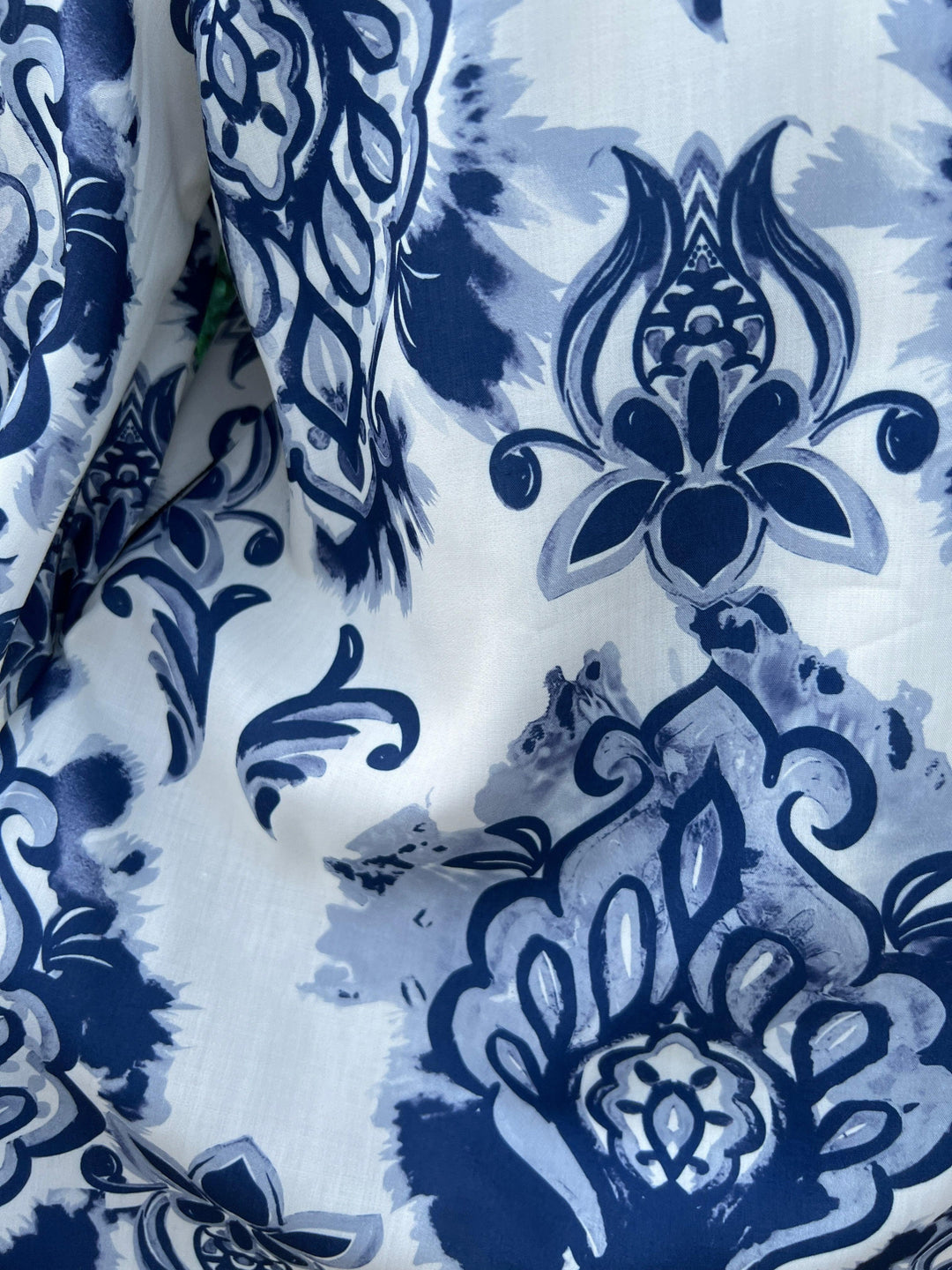 womens online boutique close up of vivid printed colorful blue and white dress