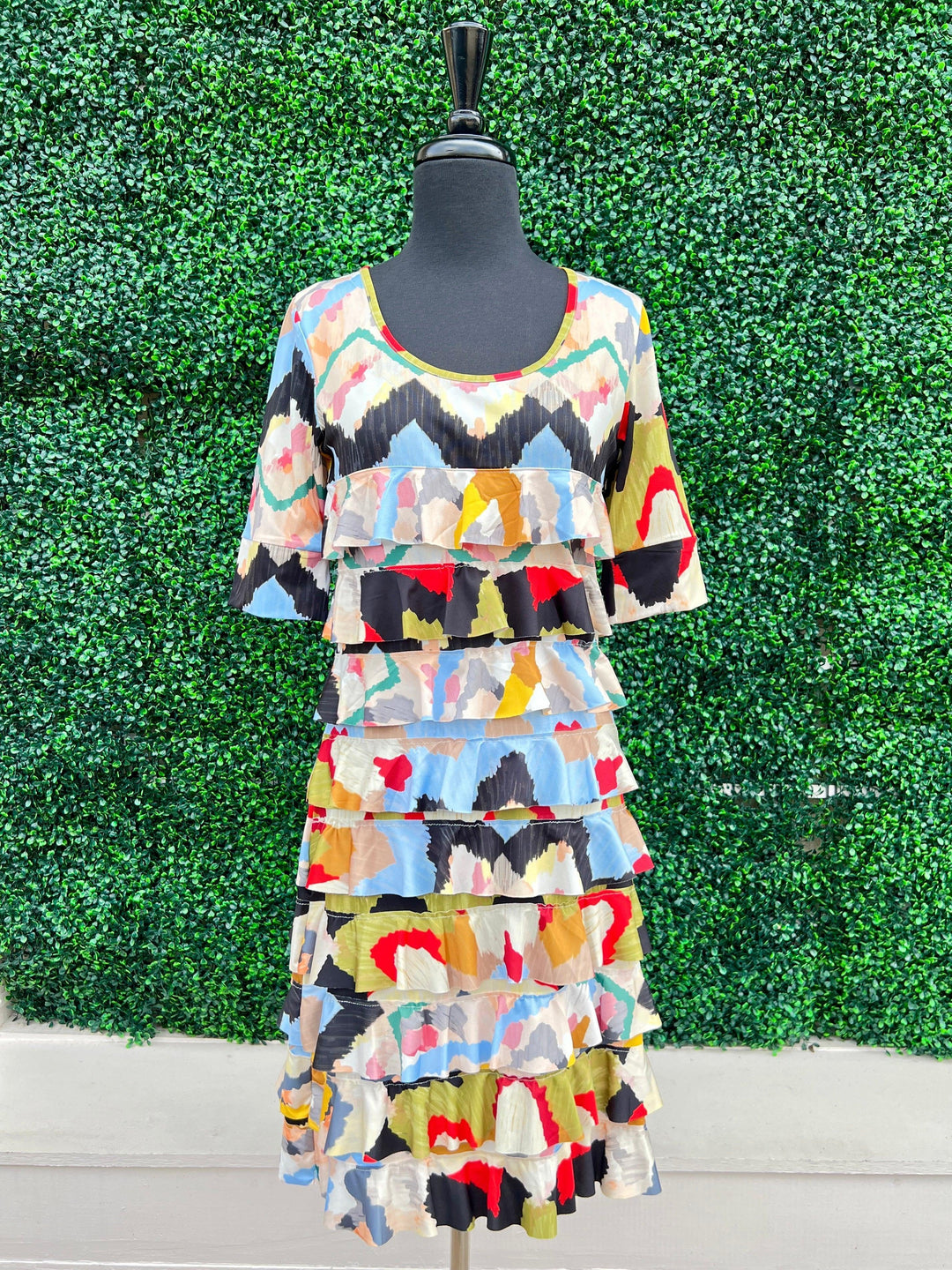 fun flirty dress with ruffles and bright pring for women over 50