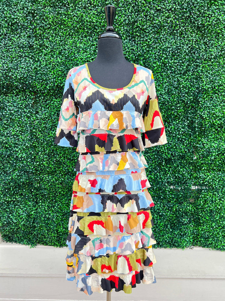 fun flirty dress with ruffles and bright pring for women over 50