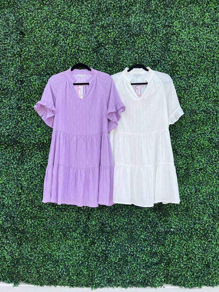 lavender and white dress from Tres Chic dress shop in houston Texas on Eastside Street