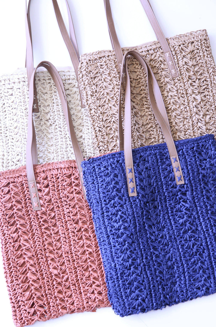 4 straw bag colors, blue, peach, tan, and natural