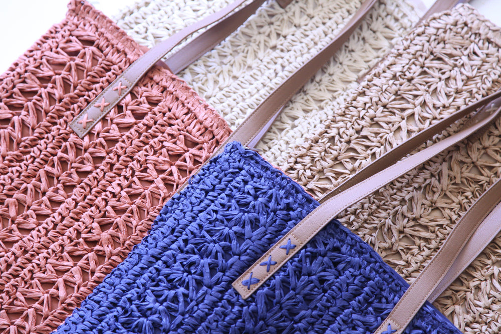 close up of the quality and details of straw tote bags in Houston on Eastside Street