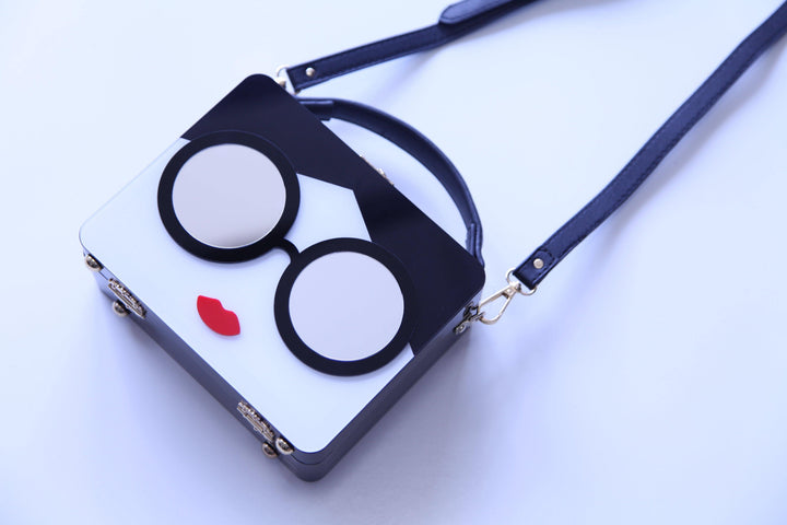 Lunchbox purse with mirrored glasses and bright red lips