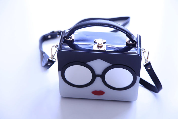 Black and white and gold hard plastic bag on online women&