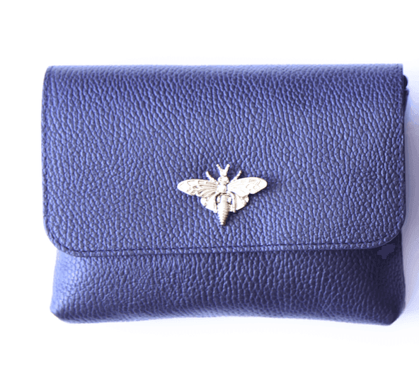 Mature women boutique with bee clasp leather bags in Houston Texas