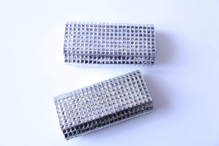 Silver and Gold clutch for formal events from Dress shop in Houston Tres Chic