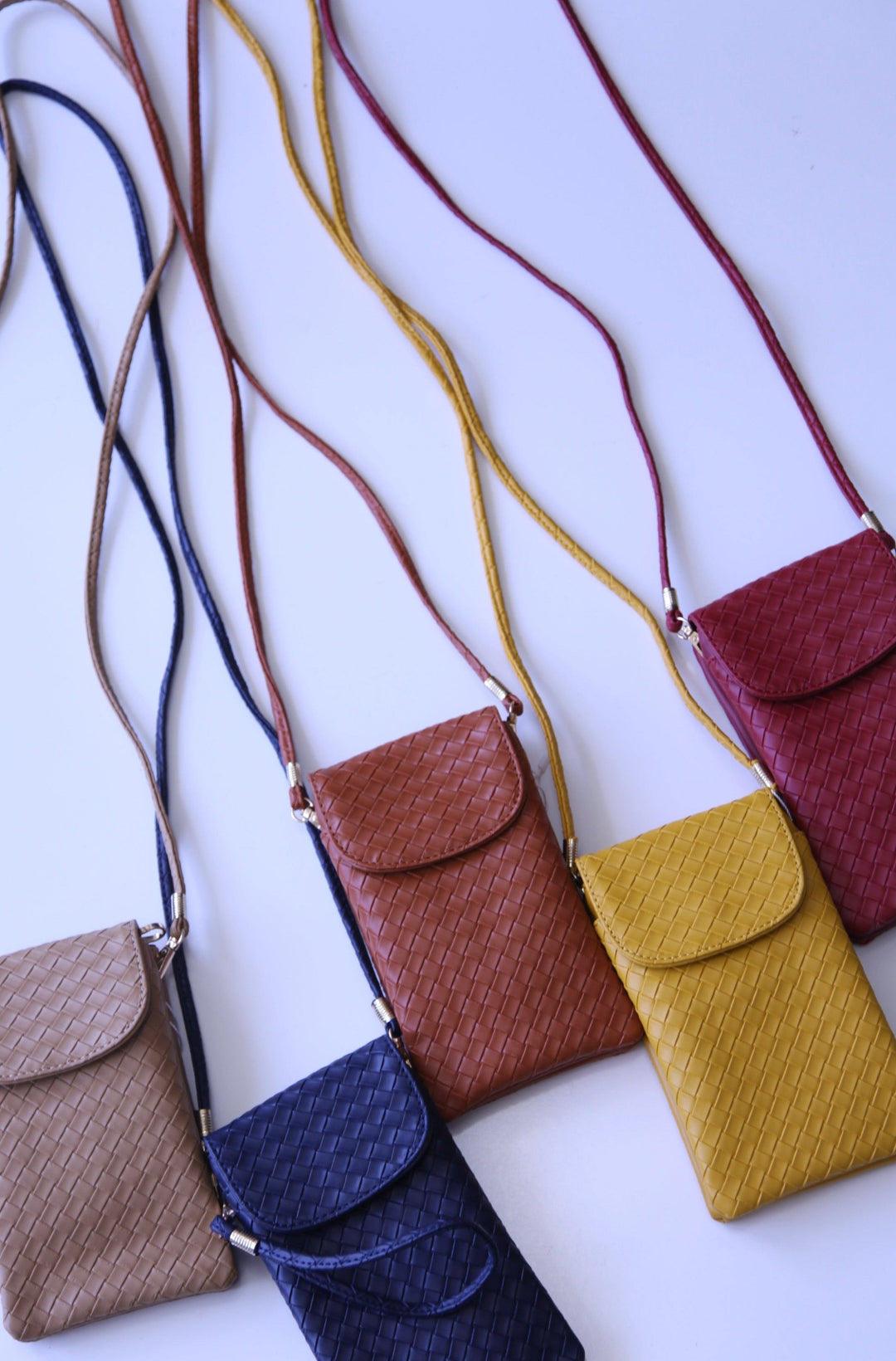 This purse comes with a long strap and a wristlet