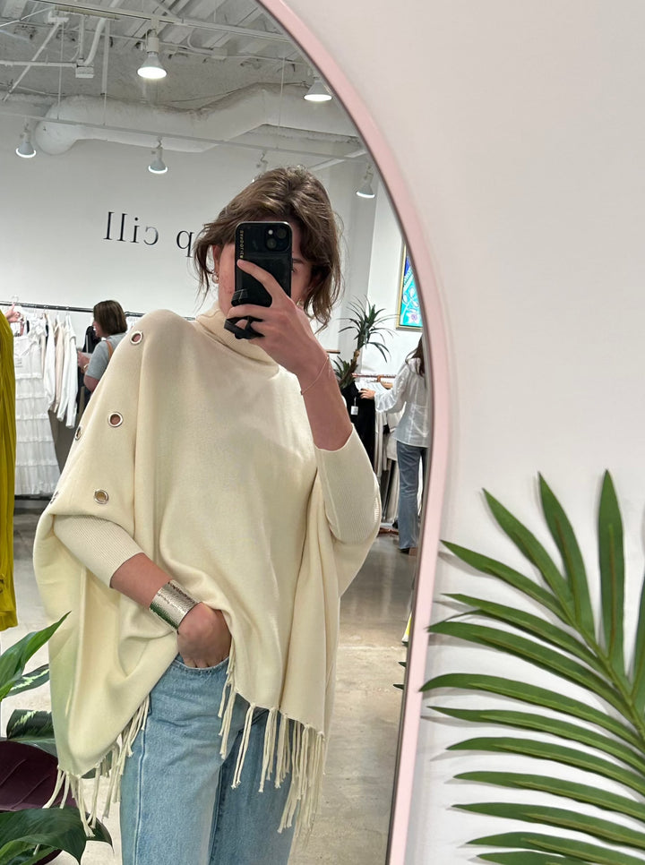 Knit Turtlenck fringed poncho grommets tres chic boutique before you collection