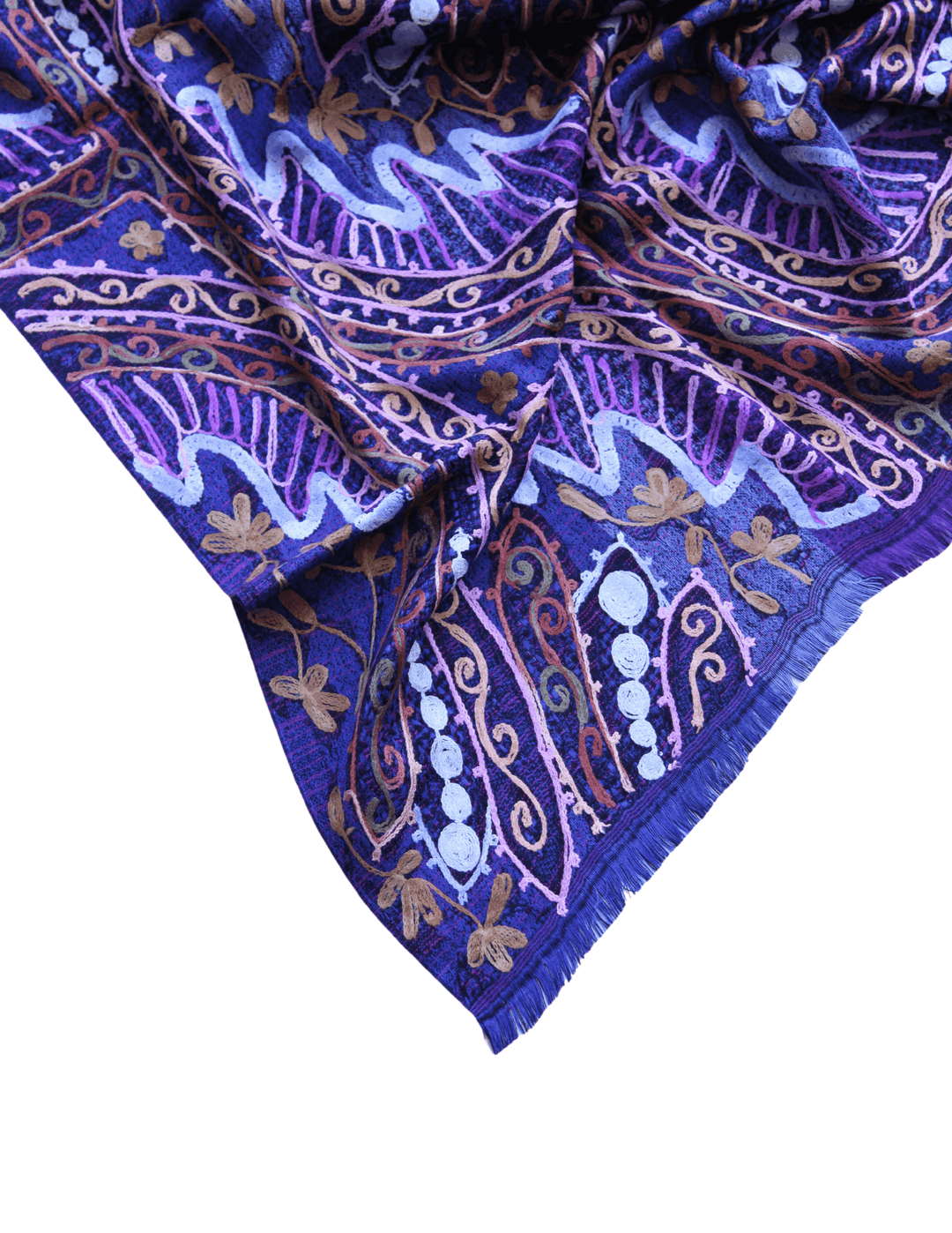 boutique with white dresses and blue purple shawls