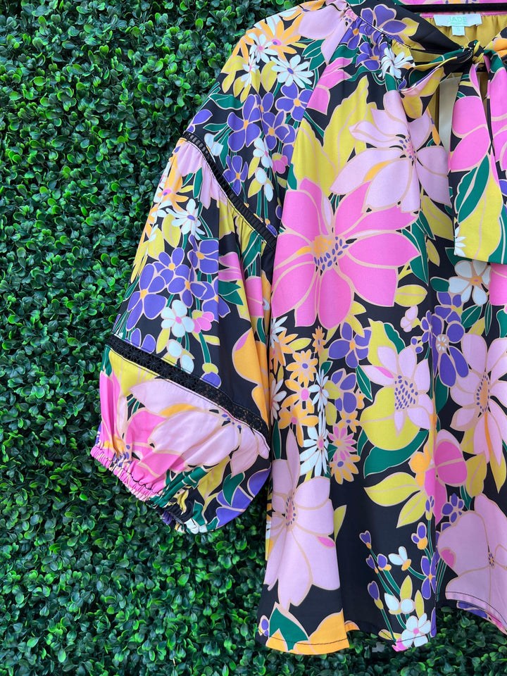 Bright floral blouse sleeve details from Tres Chic Women&
