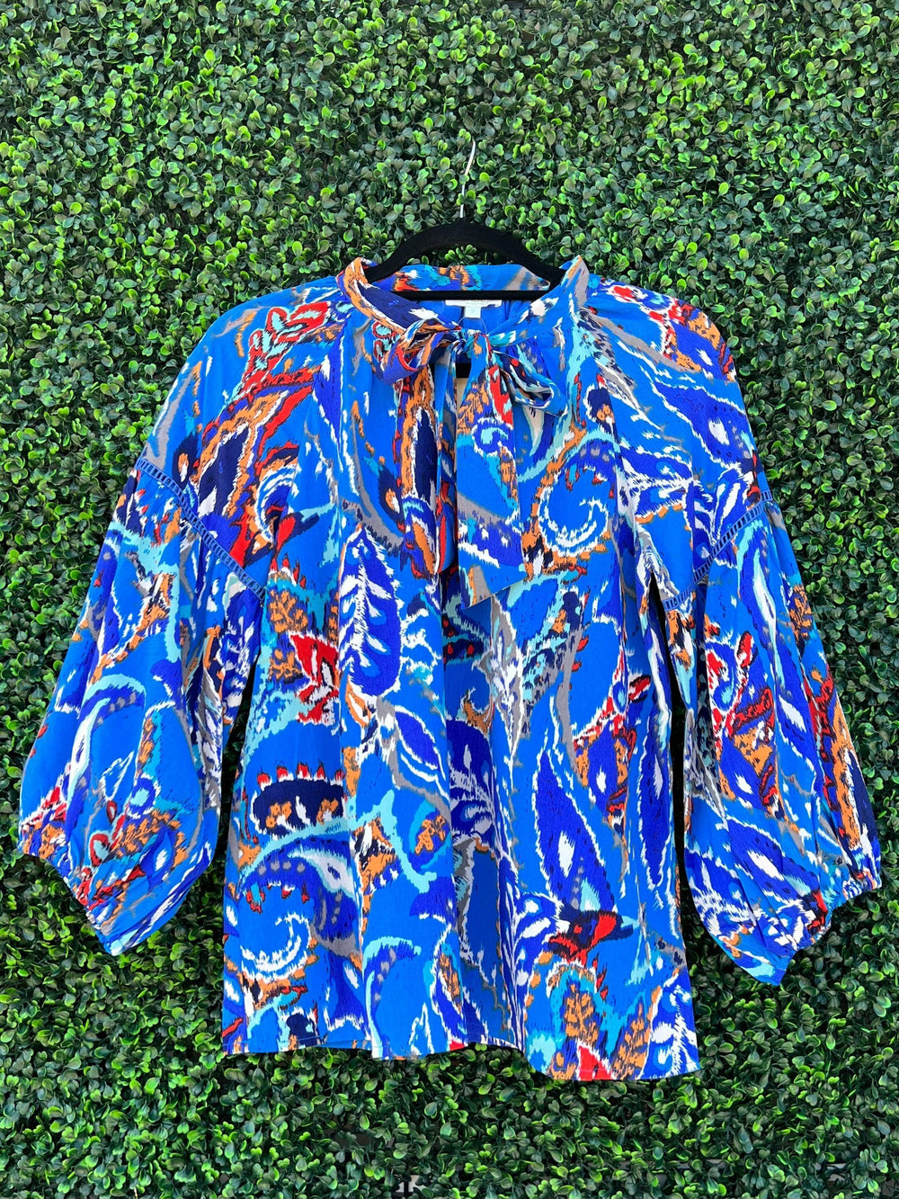 Houston boutique dress shop sells dress blouse in deep blue