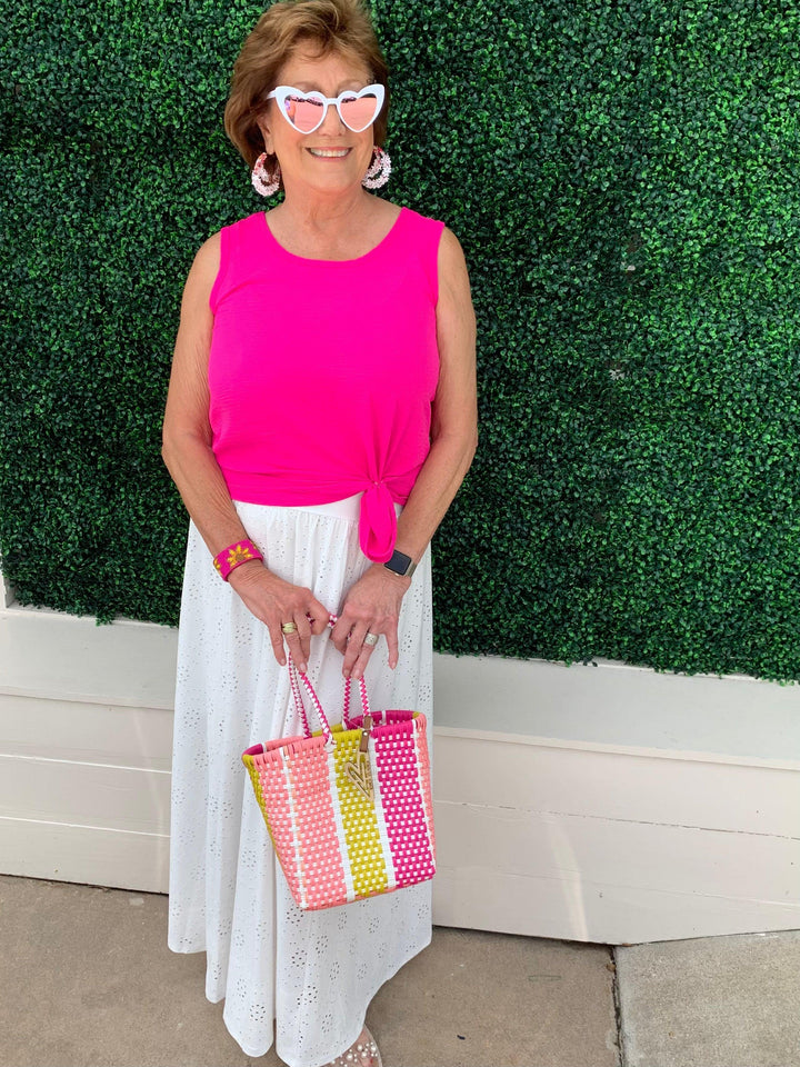 Tres Chic owner wearing tank top with a tie on the side in a summer outfit