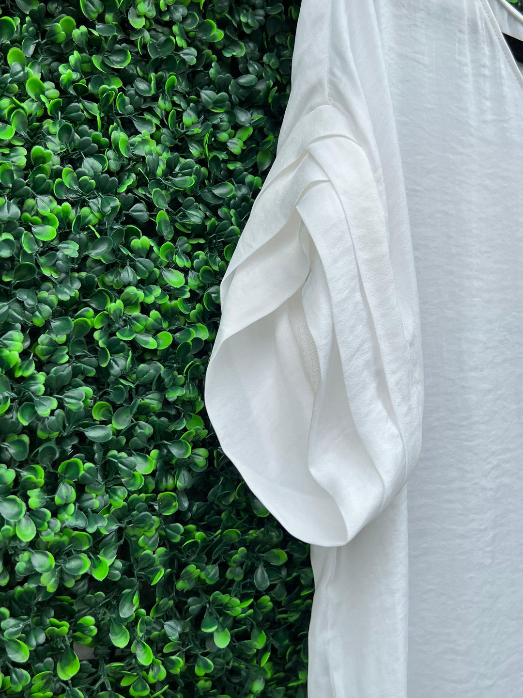 boutique with white dresses and tops