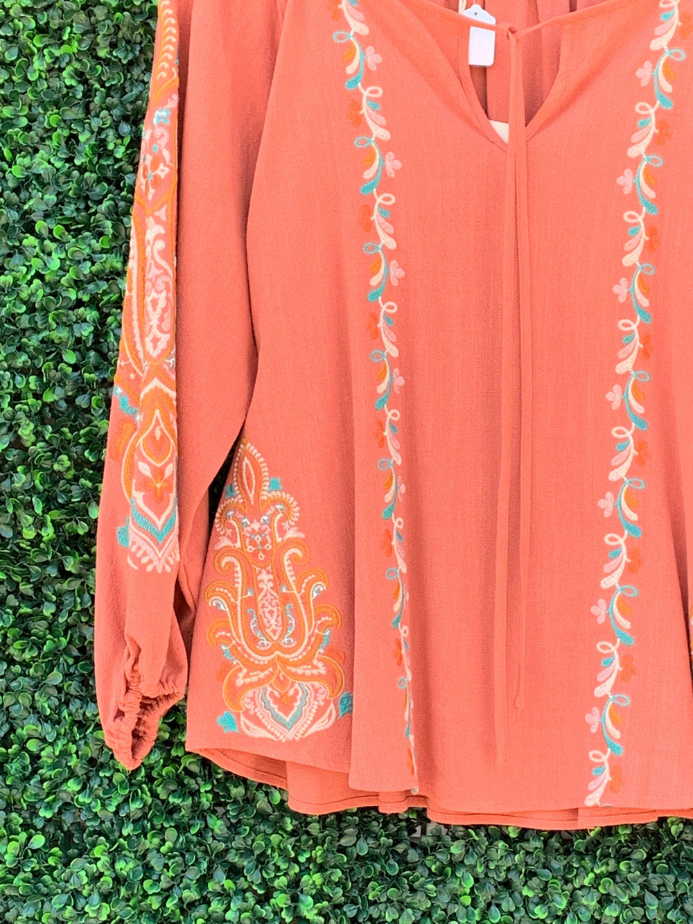 Detail on sleeve of light weight plus size top