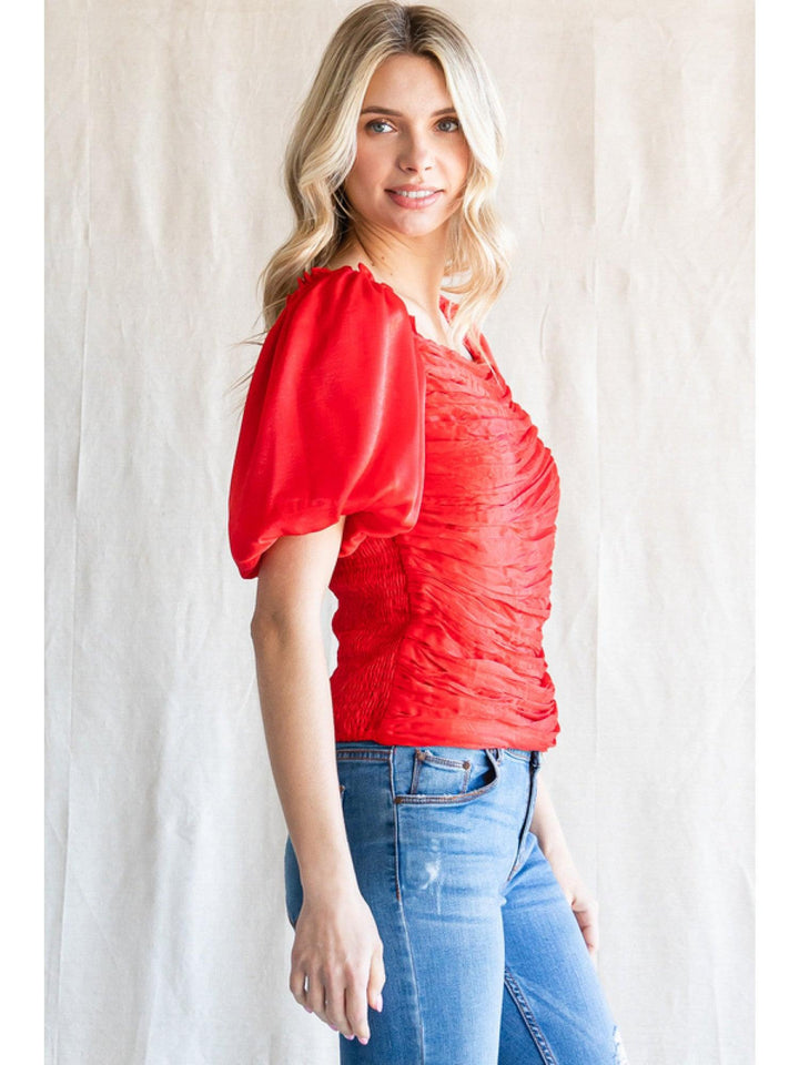 Solid red top with chest ruched, back smocked, frilled shoulder and short puffed sleeves jodifl