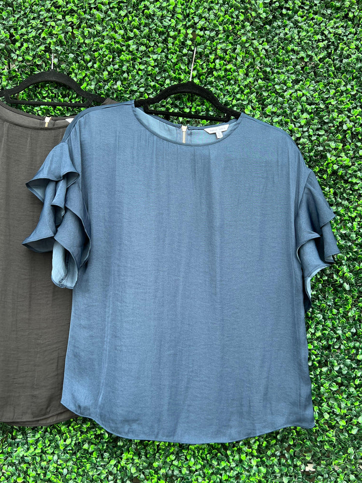 online boutique with blue silk shirt