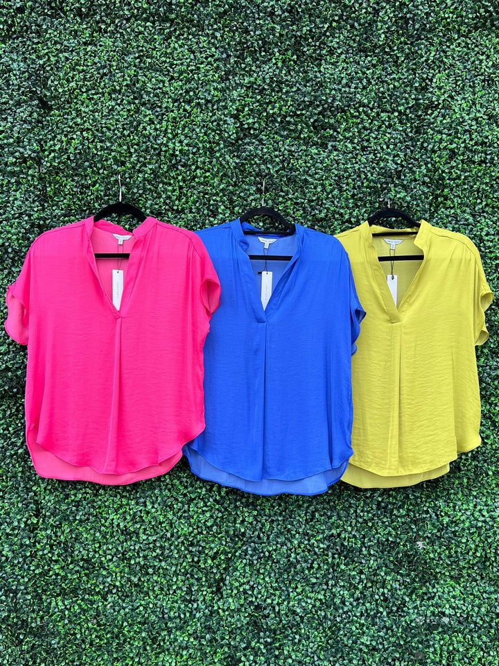 Mature women boutique with blouses in lots of silky  fabric colors