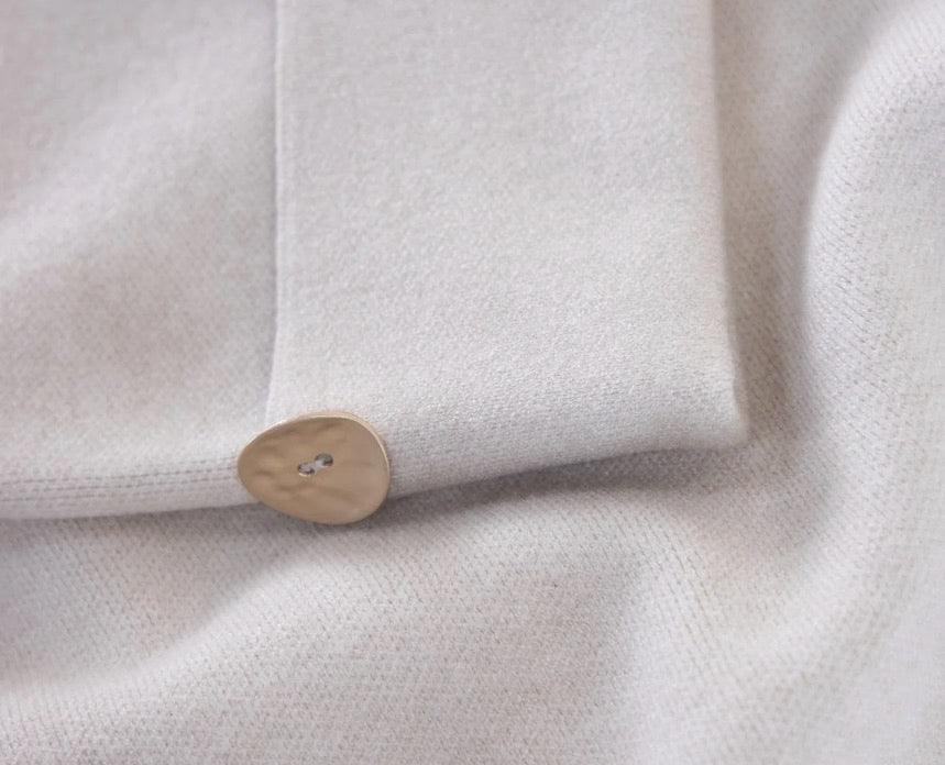 beige Turtleneck Tunic Sweater with gold button detail and silt at sides