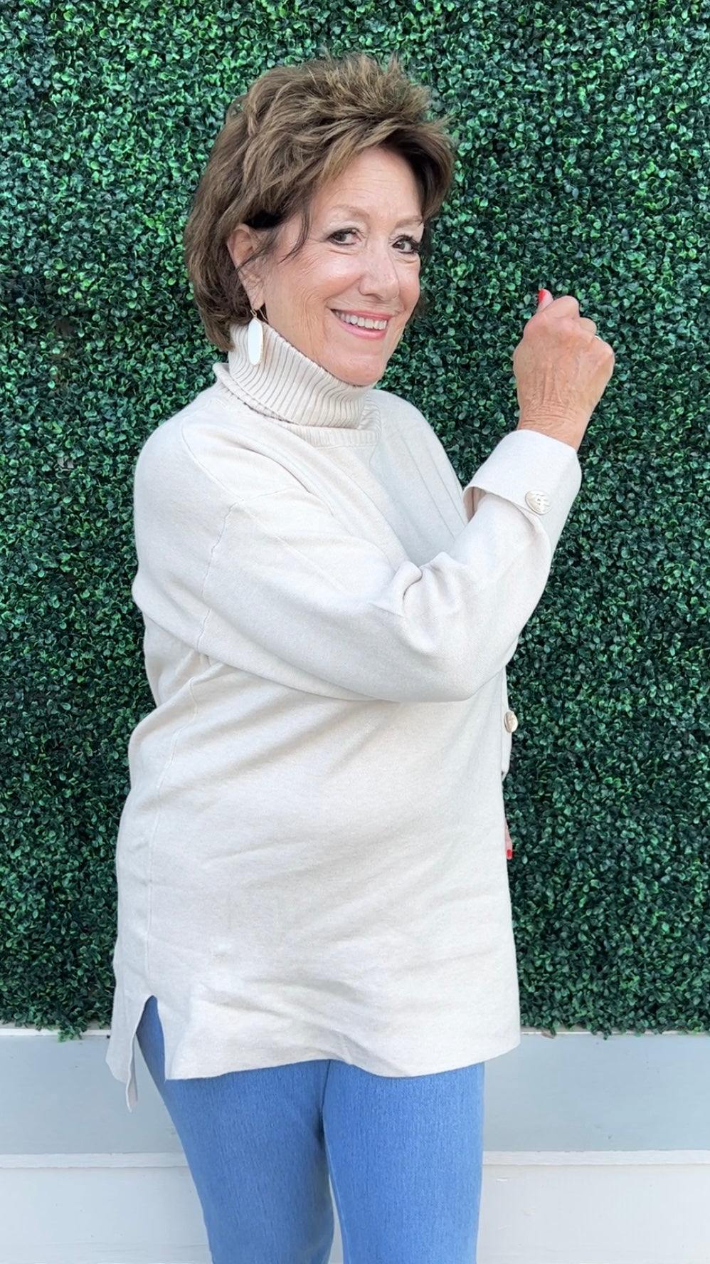 beige Turtleneck Tunic Sweater with gold button detail and silt at sides