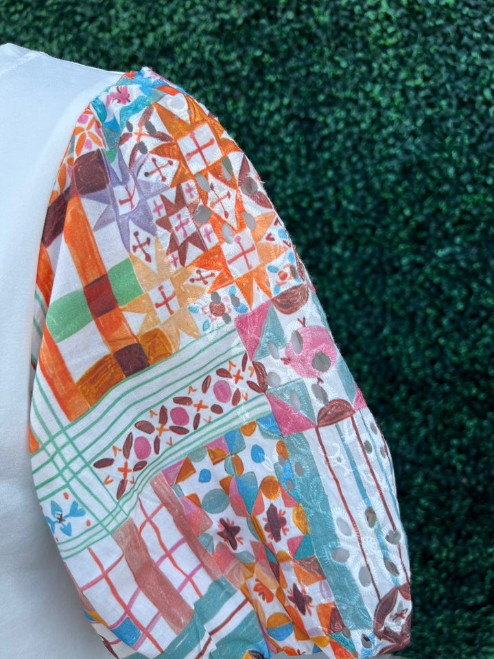 printed eyelet patchwork contrasting sleeves on white tee joy joy tres chic boutique