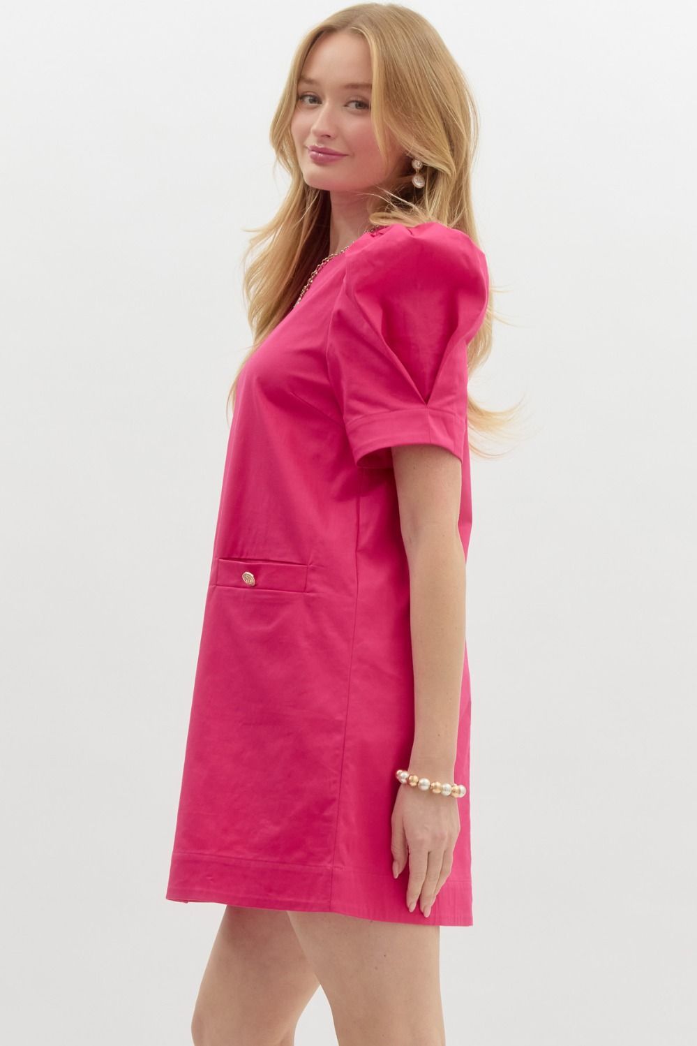 side of Jackie O Cotton Sheath Dress pink with puff sleeves and pockets with gold button 